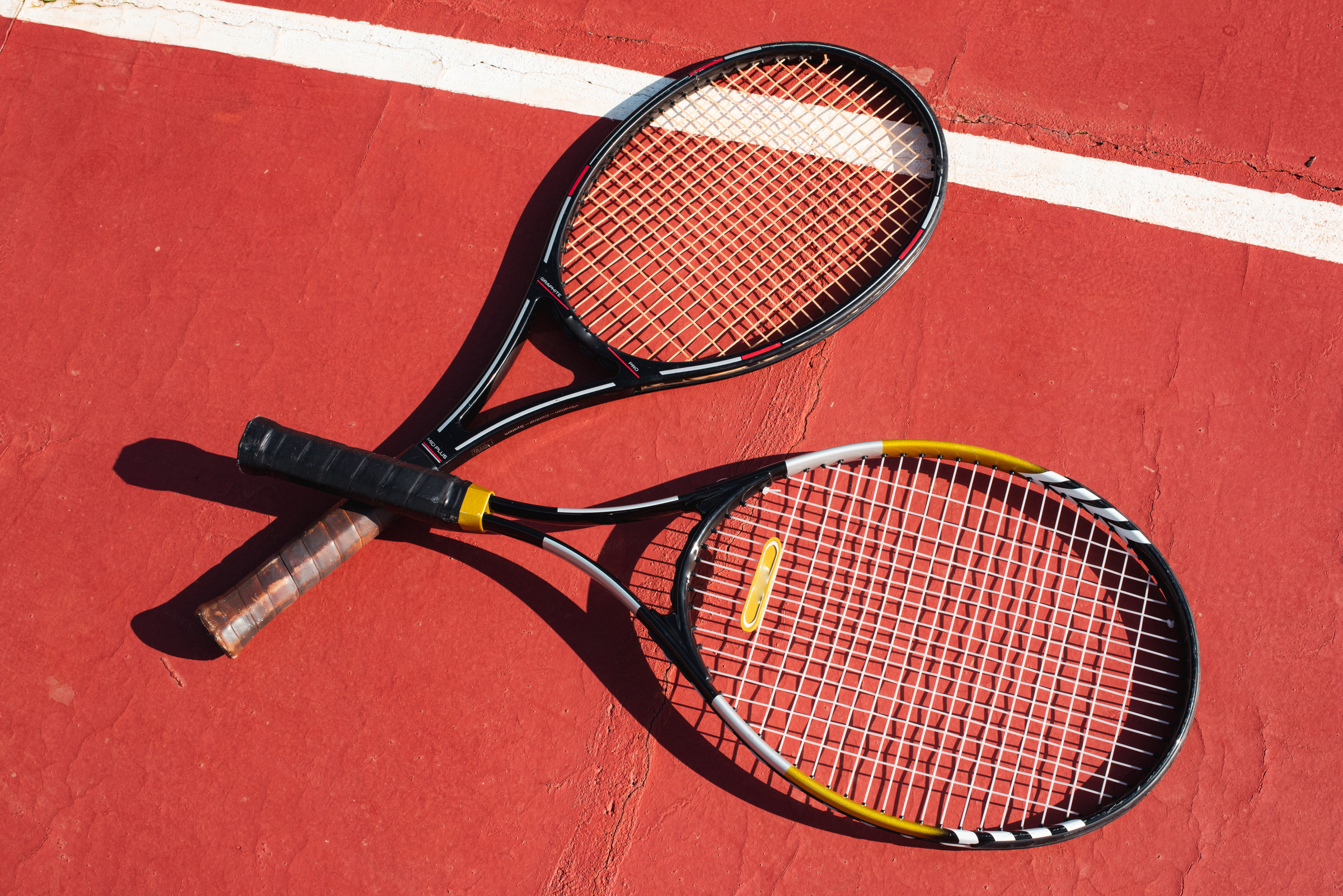 Tennis Rackets on Court